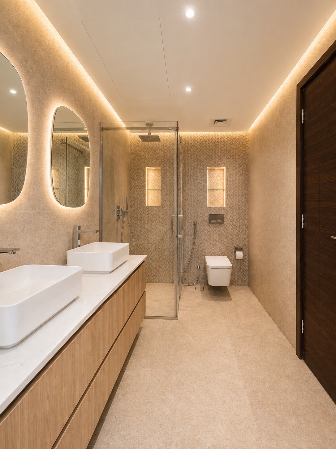 A freshly renovated modern bathroom features a double vanity with backlit oval mirrors, a glass-enclosed shower, and a
