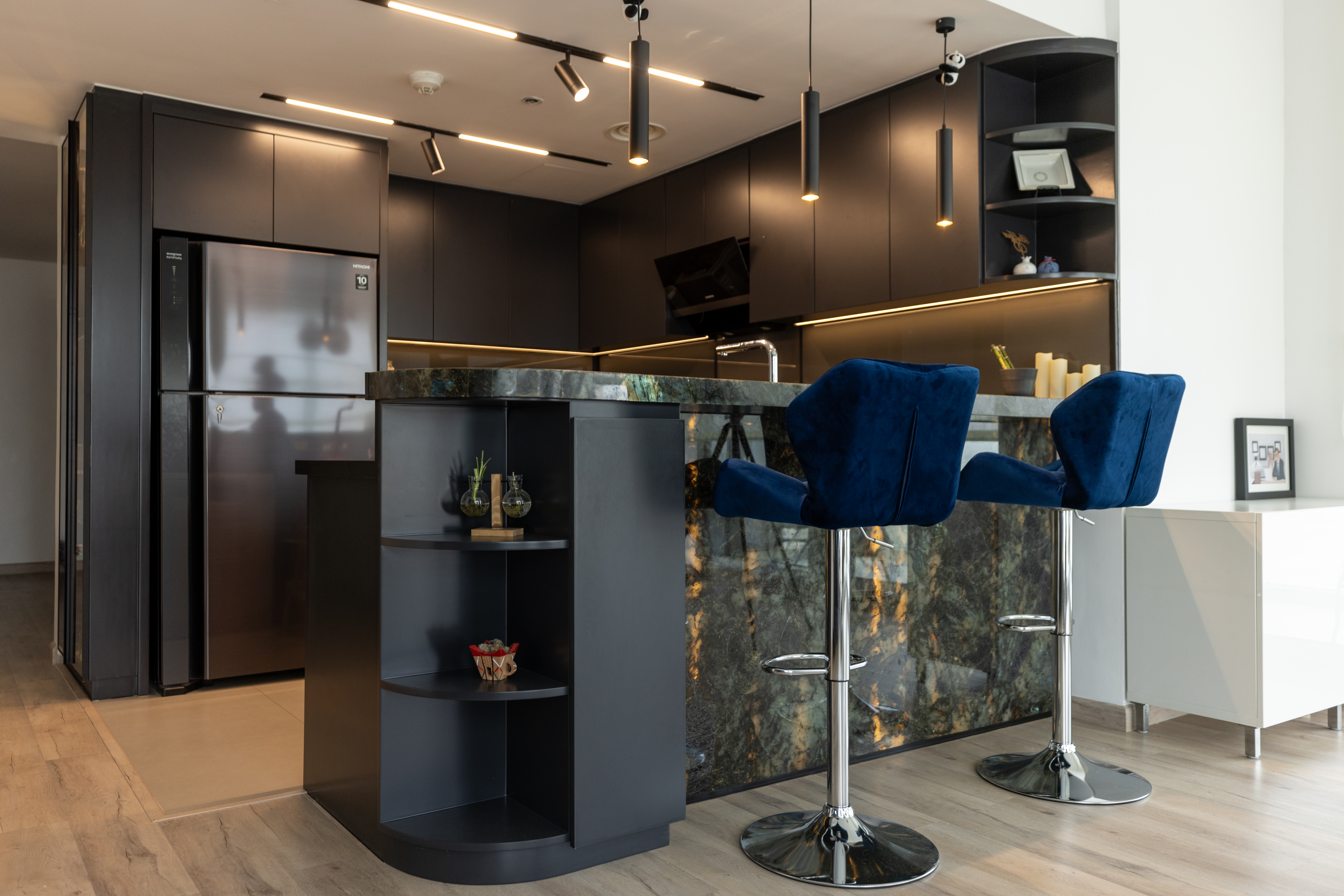Bespoke matte-black kitchen with labradorite breakfast bar