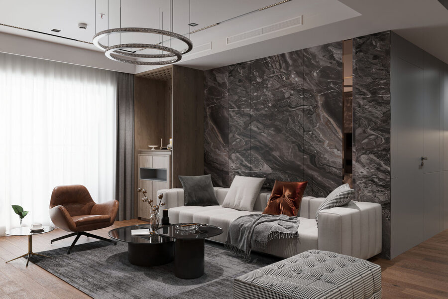 Living room with marble feature wall and chandelier