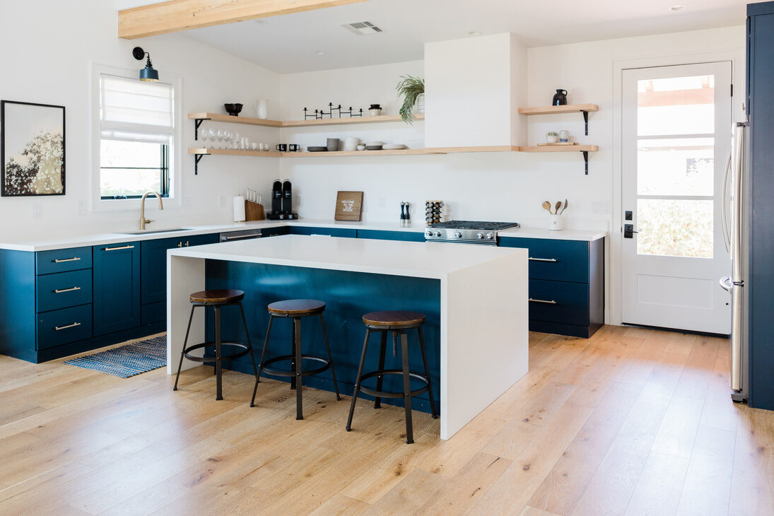 Modern kitchen with blue island and custom cabinetry