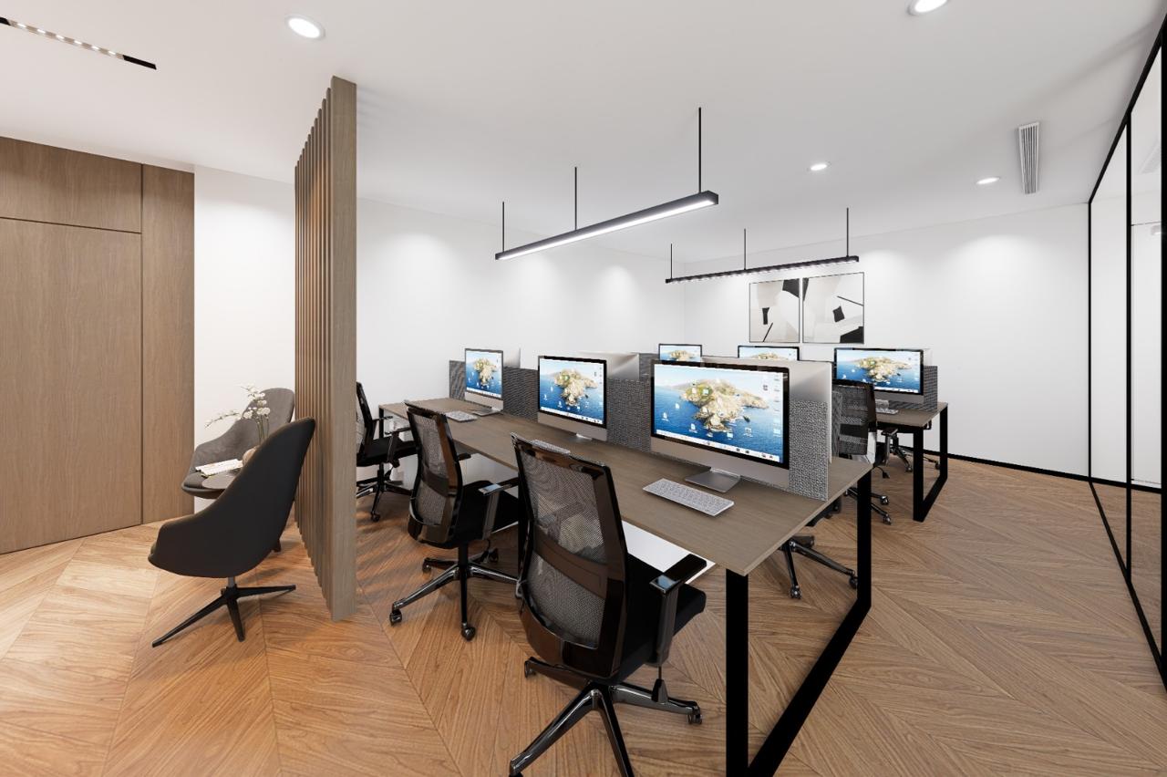 Modern open-plan office with workstations and herringbone wood flooring