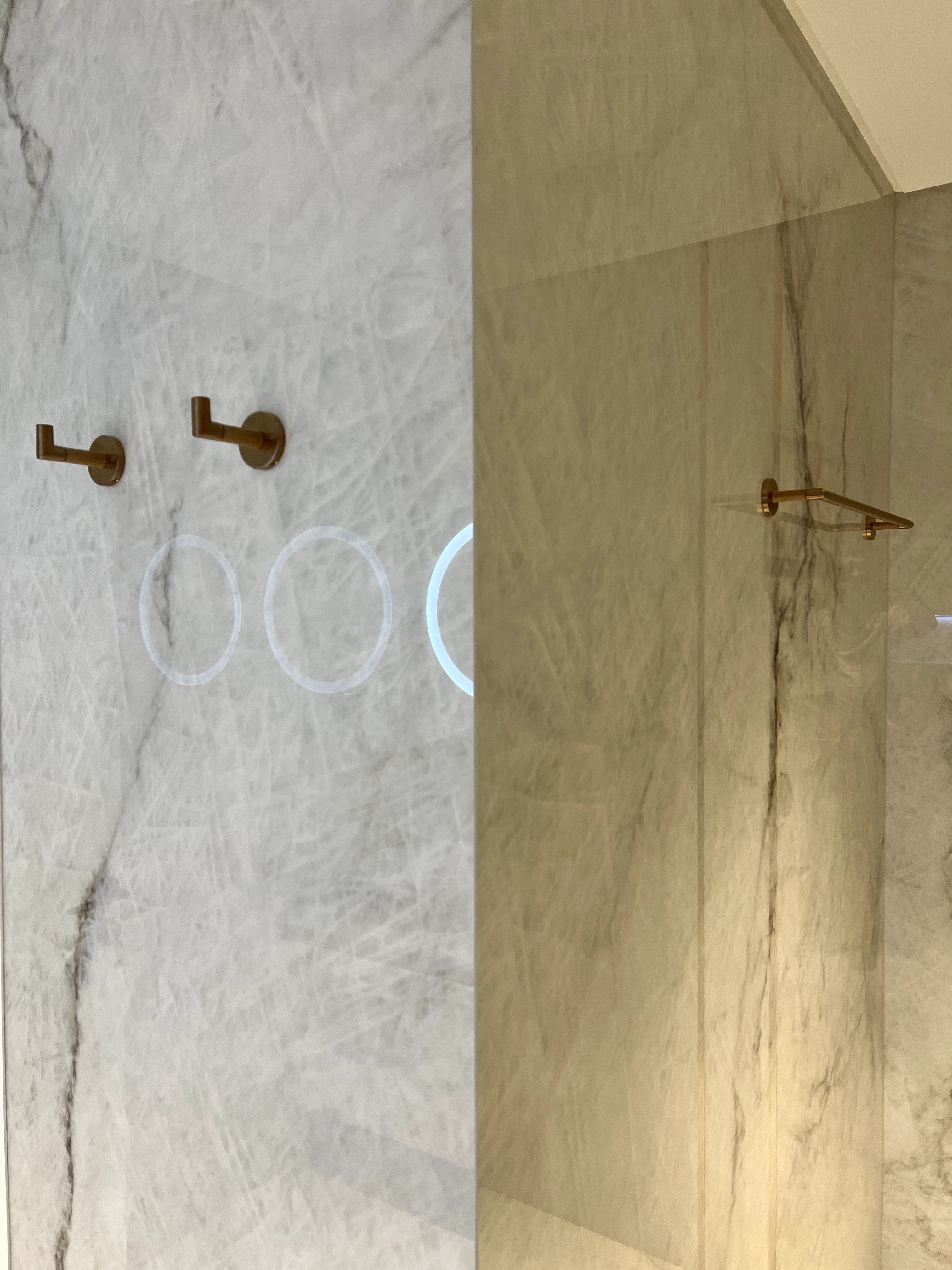 Luxury marble bathroom detail with brass fixtures