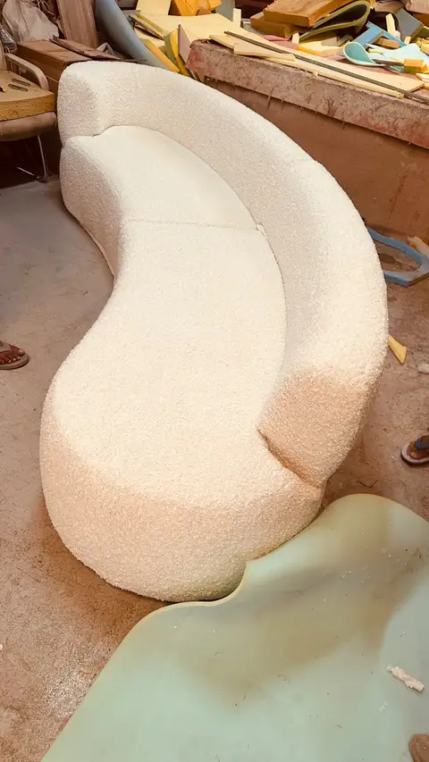 Custom boucle sofa being upholstered in the CLARE joinery workshop