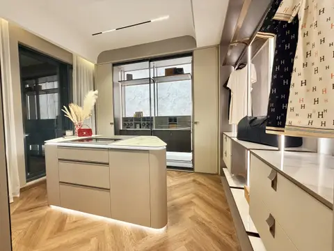 Floor-to-ceiling wardrobe run with sliding fronts and internal drawers