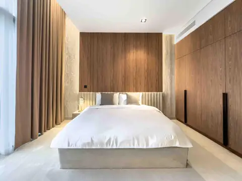 Modern bedroom with wood accent wall