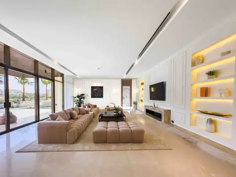 Finished living room interior with beige sectional sofa