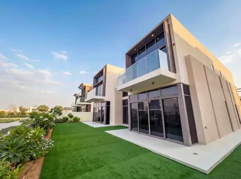 Modern minimalist villas with beige facades, expansive glass windows, and sleek — Tasaddaq Mughal Technical Services