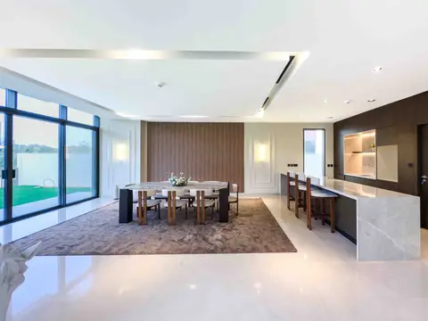 A spacious open-plan living area with a marble-top dining table, contemporary chairs — Tasaddaq Mughal Technical Services