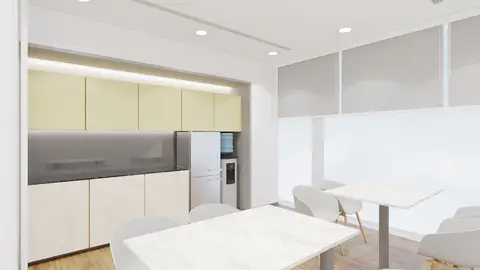 A modern office breakroom features light yellow and light wood cabinets, a dark — INTERIOXPERT TECHNICAL SERVICES CO. L.L.C