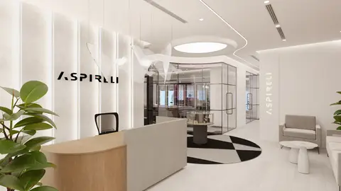 A custom light wood reception desk and a textured wall with LED strips define — INTERIOXPERT TECHNICAL SERVICES CO. L.L.C