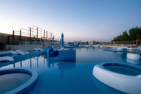 A renovated resort interior featuring blue and white finishes, with a focus on a serene, aquatic theme. — Malak Afzal