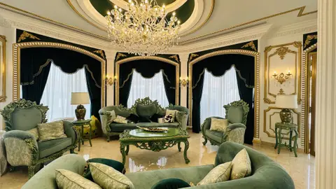 Emerald green velvet furniture with gold-painted carved wood, ornate gold — CRAFTY CLARE DECORATION DESIGN L.L.C, Dubai