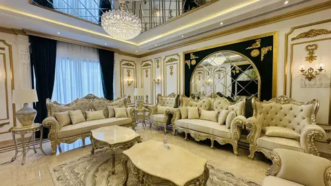 Gold-gilded furniture, ornate wall paneling, and a grand crystal chandelier — CRAFTY CLARE DECORATION DESIGN L.L.C, Dubai