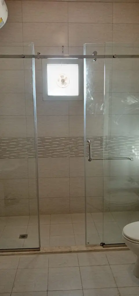Bathroom with sliding glass shower enclosure