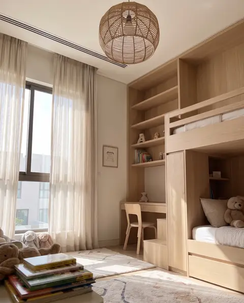 Custom light wood bunk bed system with built-in shelving