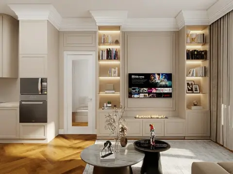 A sophisticated open-plan living space features an integrated entertainment wall with a mounted — Anel&CO, Business Bay
