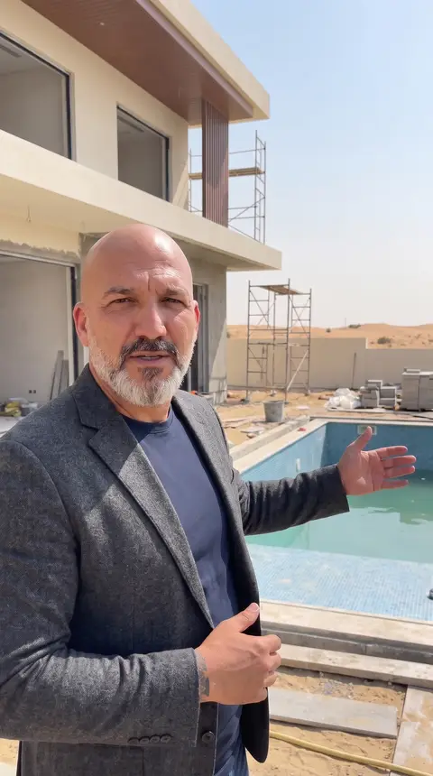 Modern villa renovation is underway, featuring a partially filled swimming pool and scaffolding — Chadi Baaklini, Dubai