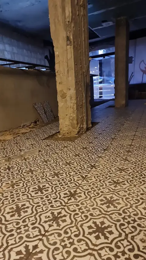 A renovation-in-progress scene showcases newly laid patterned floor tiles extending across a large — Chadi Baaklini, Dubai