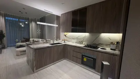 Light wood cabinetry, white marble countertops, and an integrated gas — Lacasa Line Decoration Design & Fit-Out L.L.C, Dubai