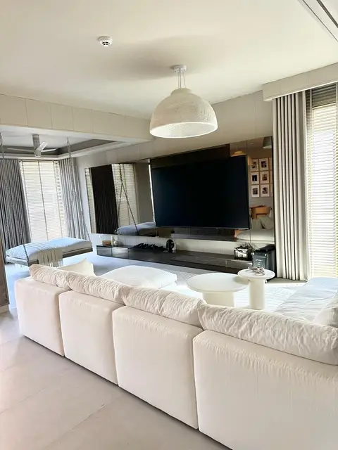 A bright and spacious modern living room features a large white — Lacasa Line Decoration Design And Fitout LLC, Dubai