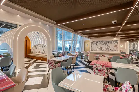 Arched architectural elements with integrated LED lighting, geometric floor tiles, and botanical wall — Muhammed  Gani