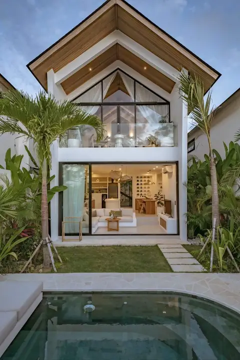 A stunning modern tropical villa showcases a seamless indoor-outdoor living experience — ROUND TRIANGLE DECORATION CO. L.L.C