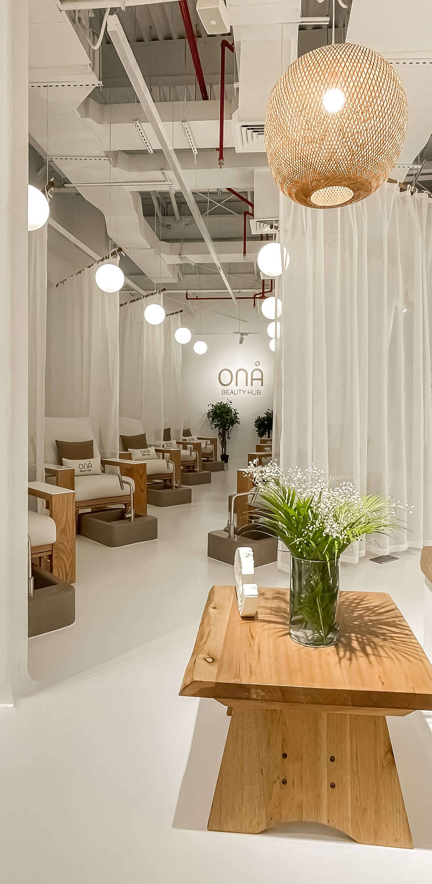 Ona Beauty Hub salon fit-out by Crafty Clare, white interior with pedicure chairs and oak seating