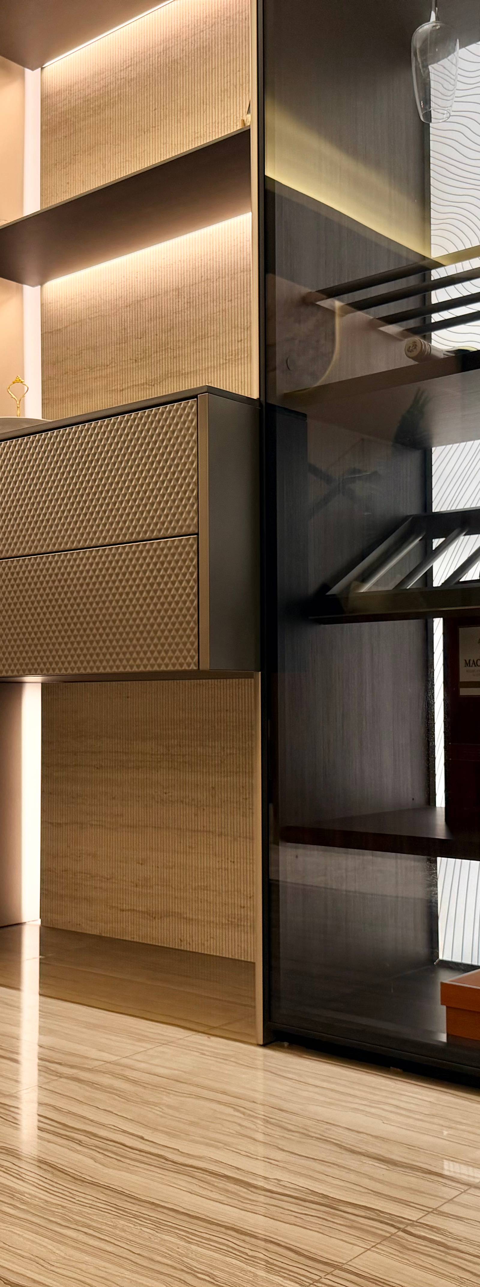Kitchen joinery detail with textured cabinetry and backlit fluted wall panel