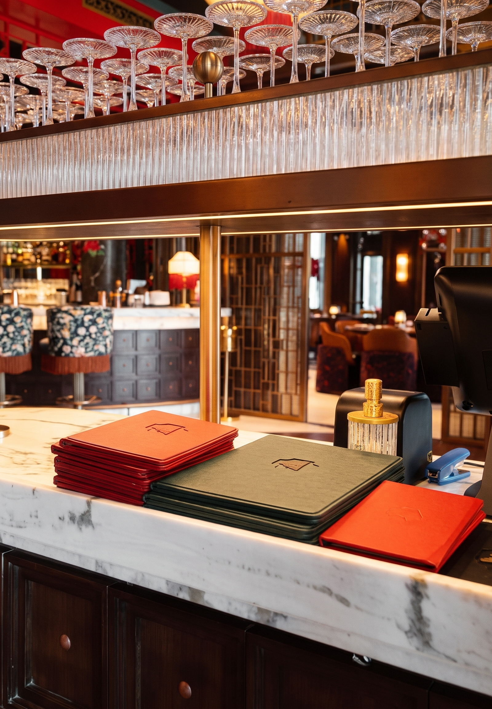 Bar counter with marble top and red menus in restaurant
