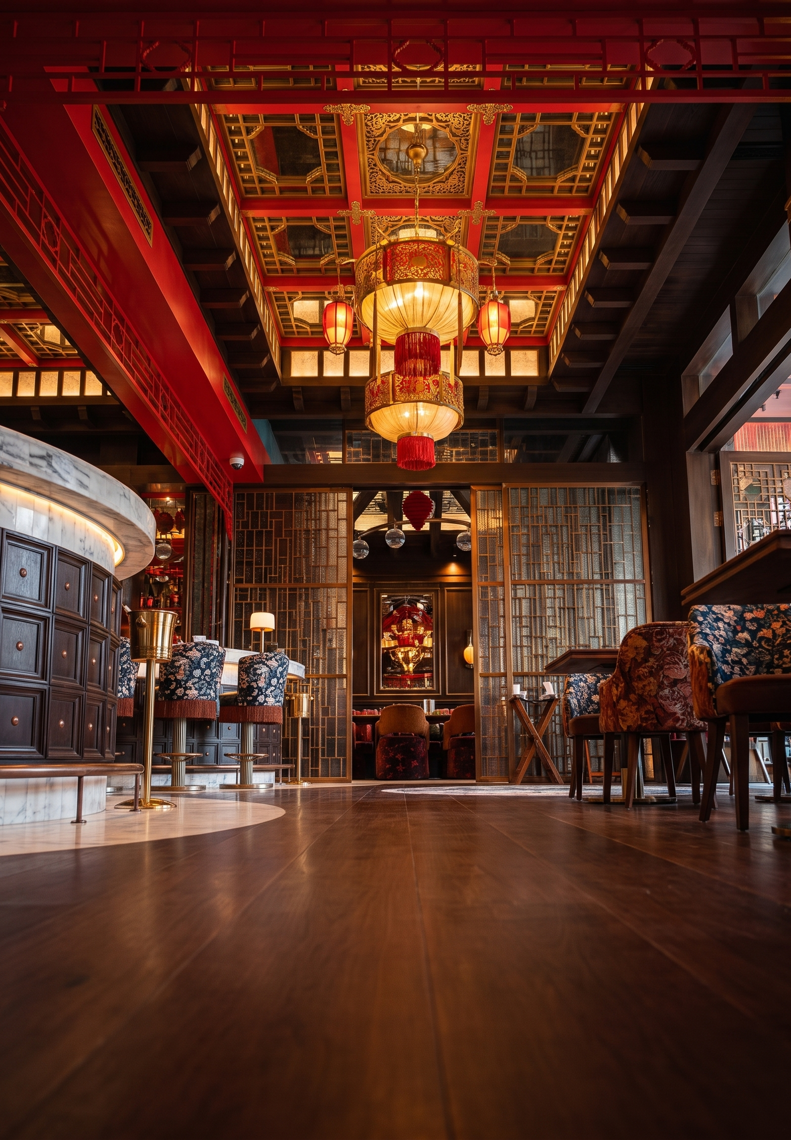 Restaurant interior with grand red and gold ceiling, curved marble bar