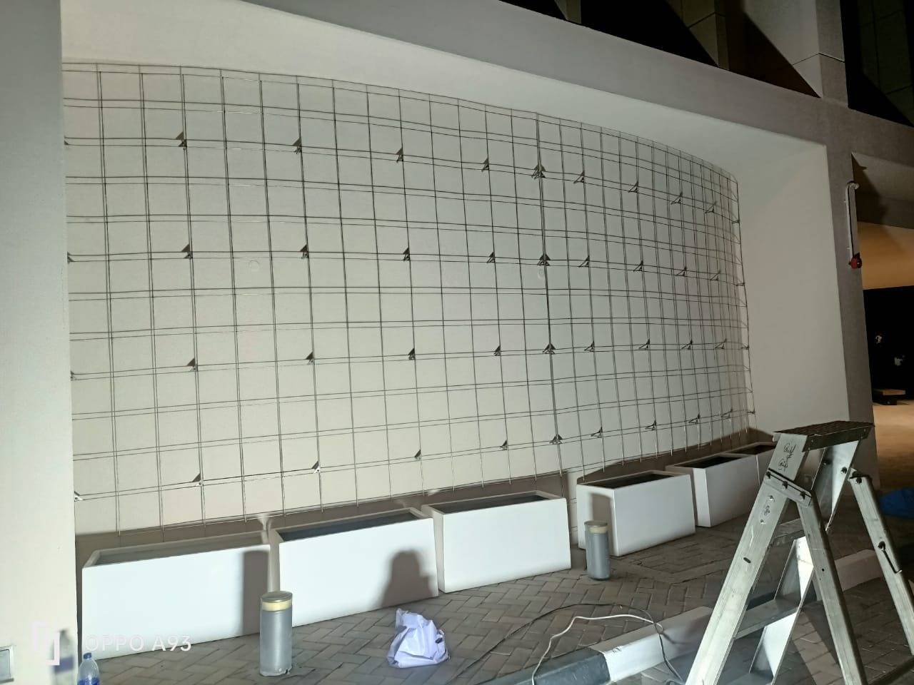 Curved exterior wall with metal grid framework awaiting cladding at a steel structure fabrication Dubai project