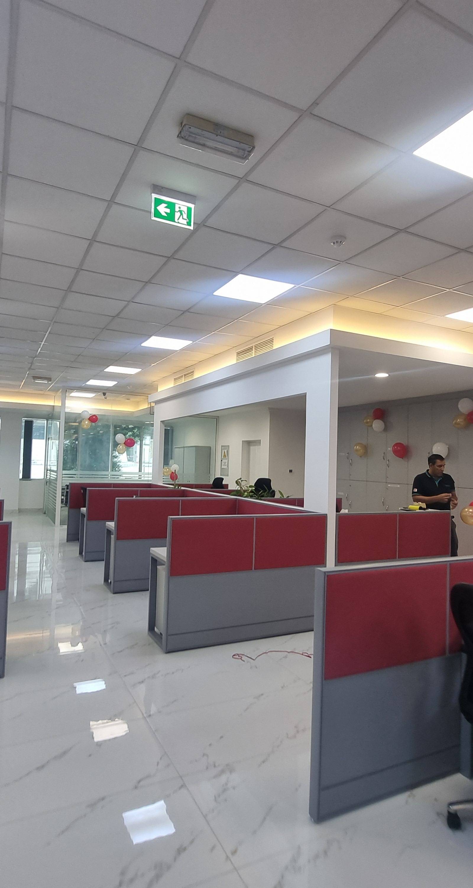 Open-plan office floor with cubicle workstations