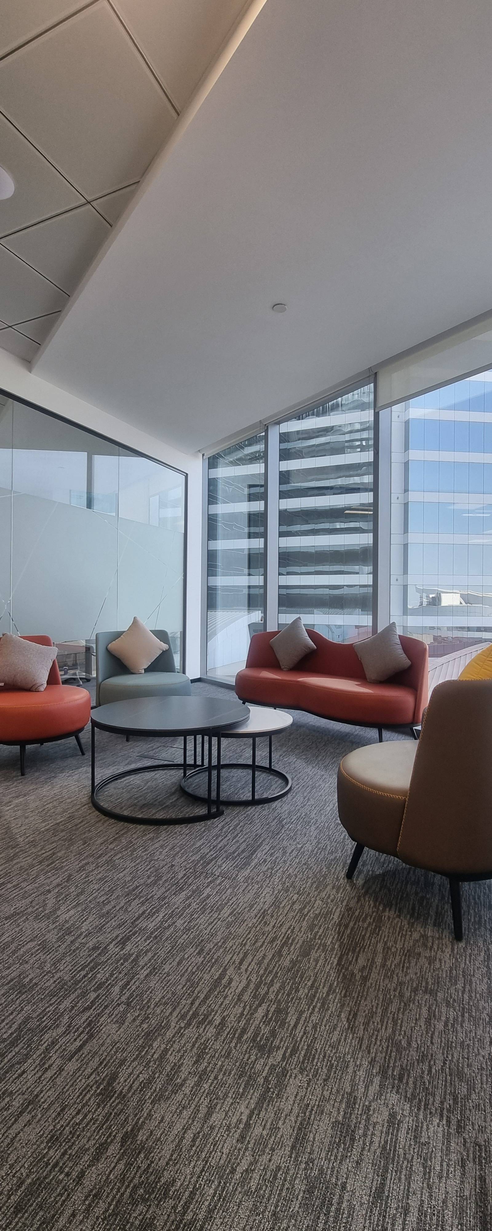 Finished office lounge fit-out with contemporary seating and city views