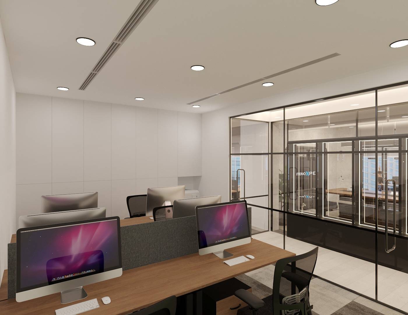 Open plan office workstations with wooden tops and grey privacy screens separated from a meeting room by black framed glass partitions in a completed Dubai fit out