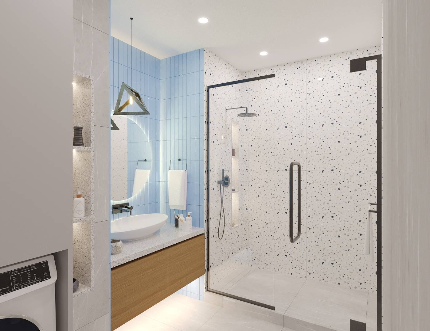 Bathroom interior fit out in Dubai with a light blue vertical subway tile accent wall, round backlit mirror, white vessel sink on terrazzo countertop, shower enclosure and built-in washing machine