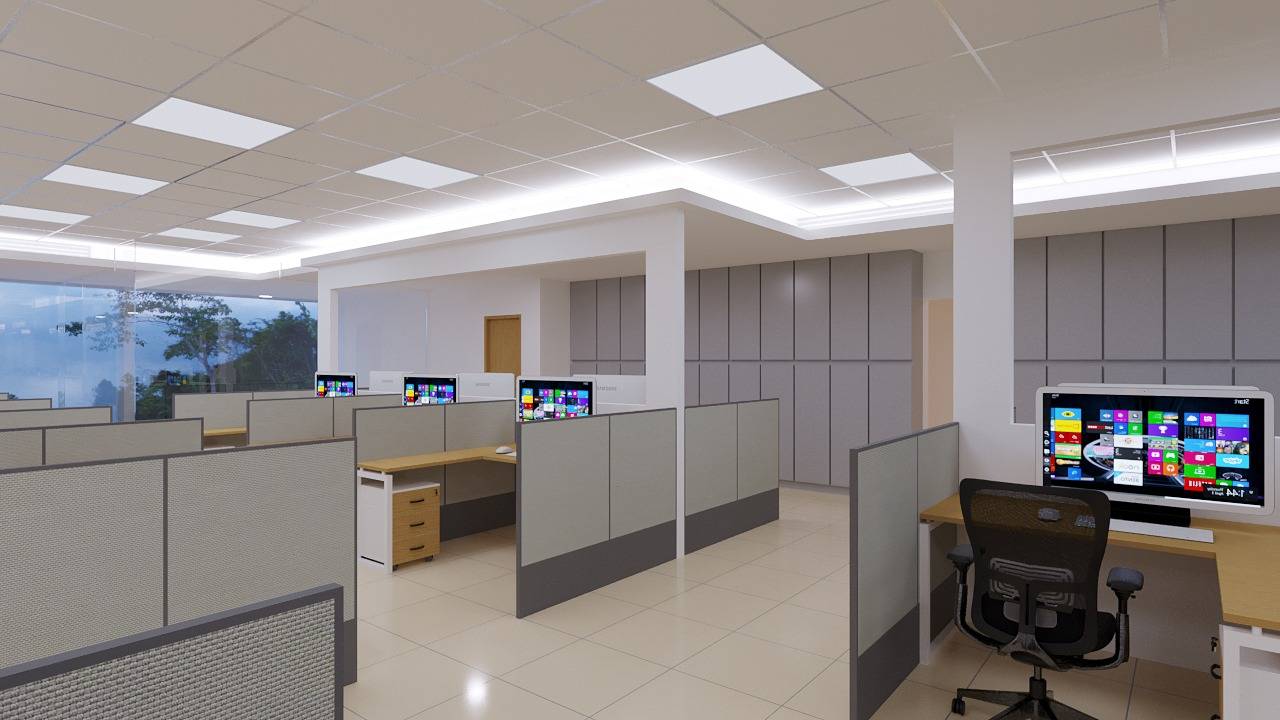 Open-plan office fit out in Dubai with light wood cubicle workstations, grey partitions, recessed ceiling lights and built-in storage cabinets