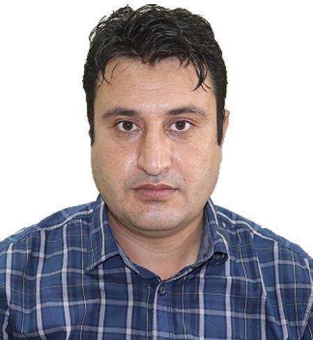 Malak Afzal, founder, in a blue plaid shirt