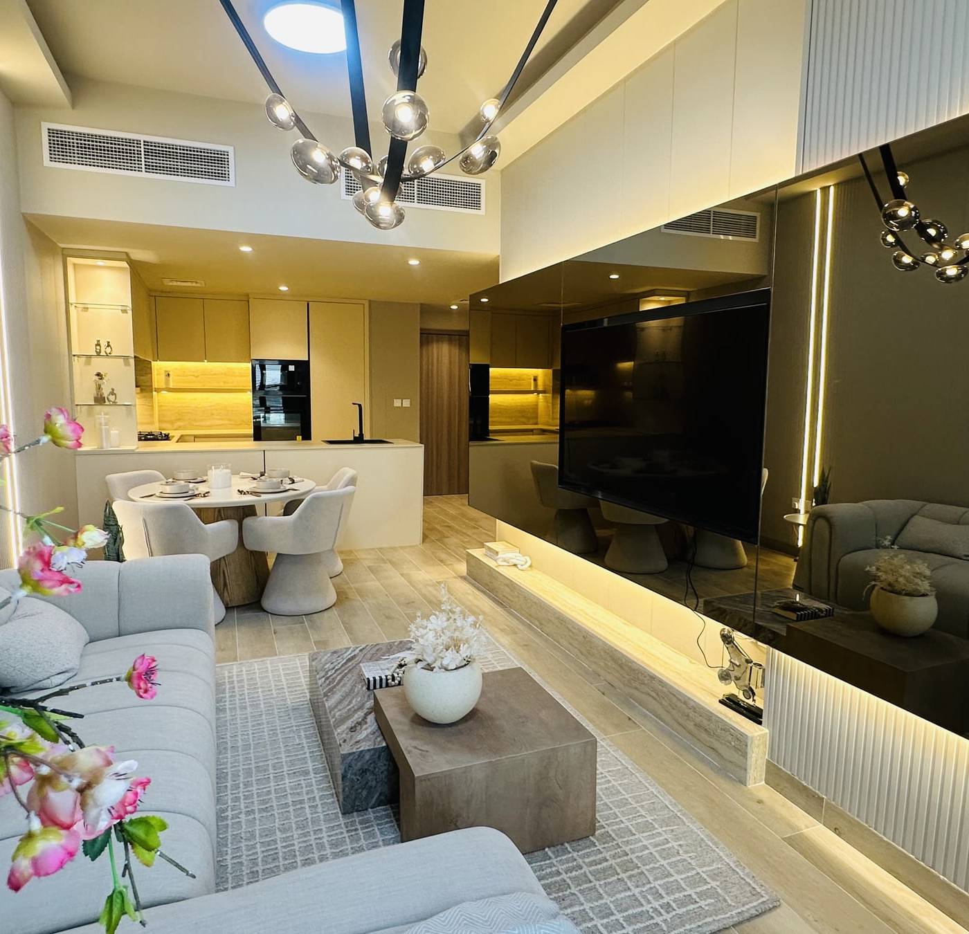 Modern apartment living room and open kitchen fitted out by CLARE