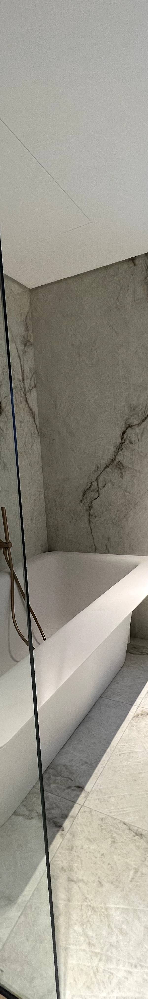 Luxury bathroom with freestanding bathtub and marble