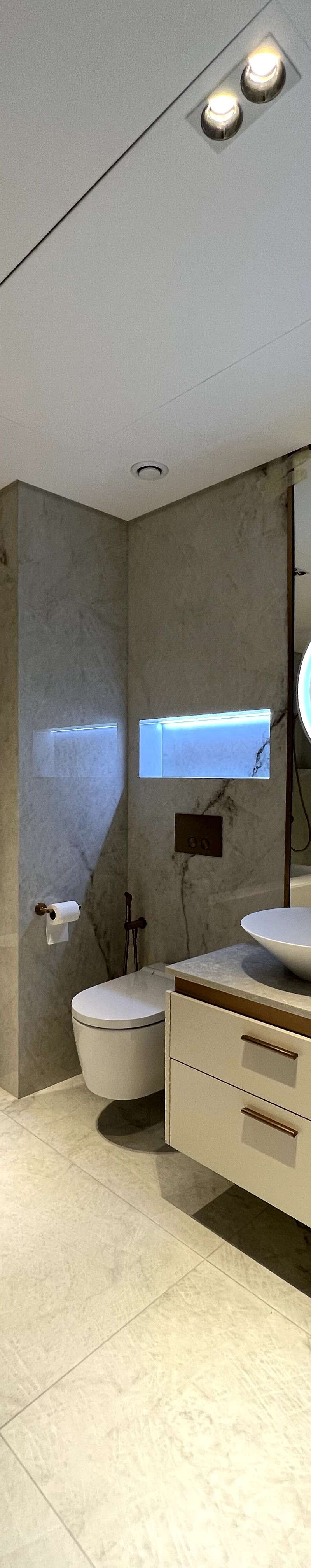 Luxury bathroom with marble tiles and dual vanity
