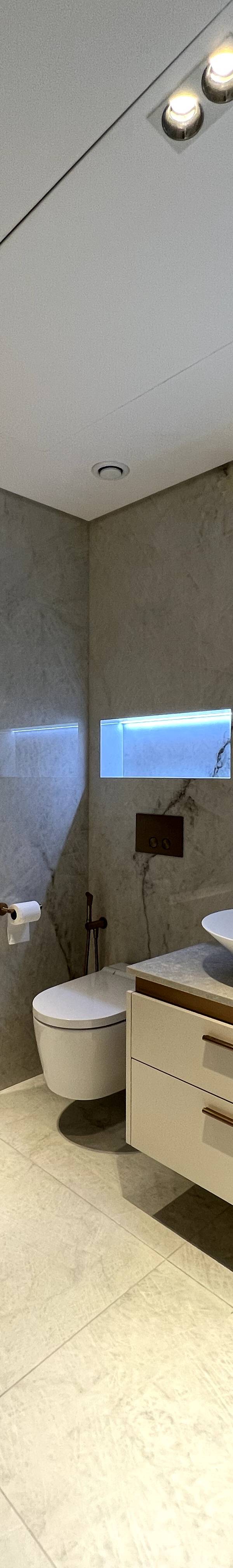 Luxury bathroom with marble tiles and dual vanity