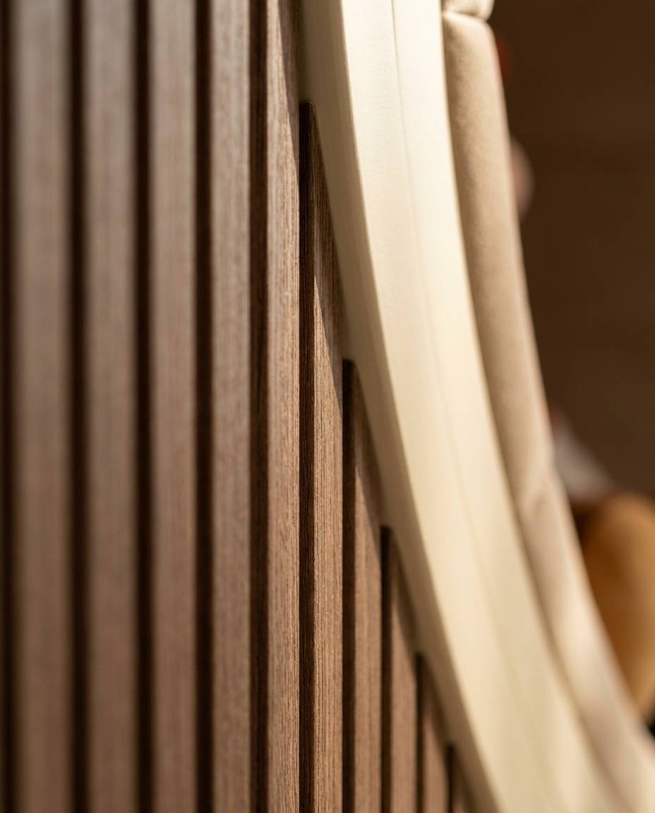 Vertical wooden slat paneling with a curved light frame and beige upholstery showing the detail finish that shapes <a href=