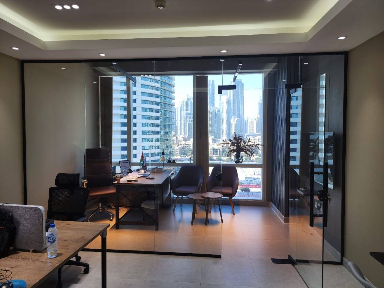 Glass-partitioned manager's office — commercial fit-out by Noor Al Sundus Contracting, Dubai