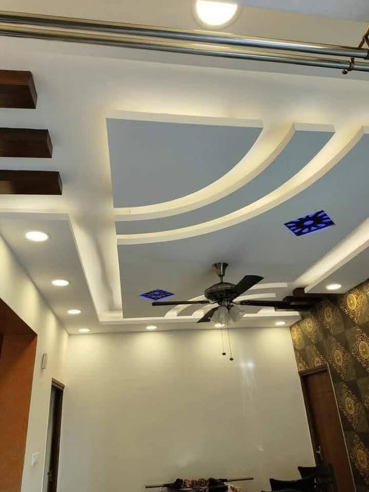 Modern living room with false ceiling and cove lighting completed after Emaar villa renovation approval