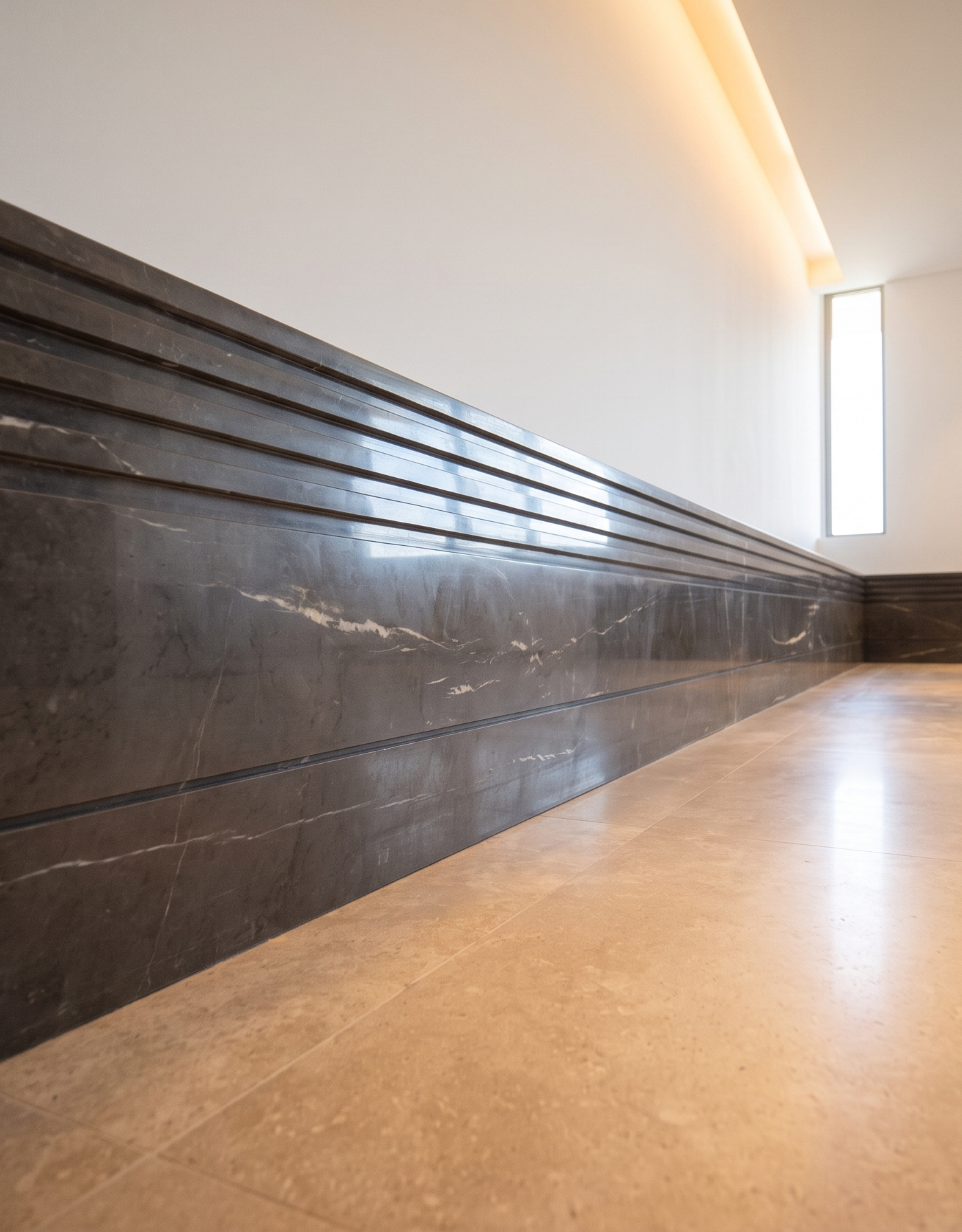 Luxury villa renovation Dubai hallway with dark marble wainscoting and linear ceiling lighting