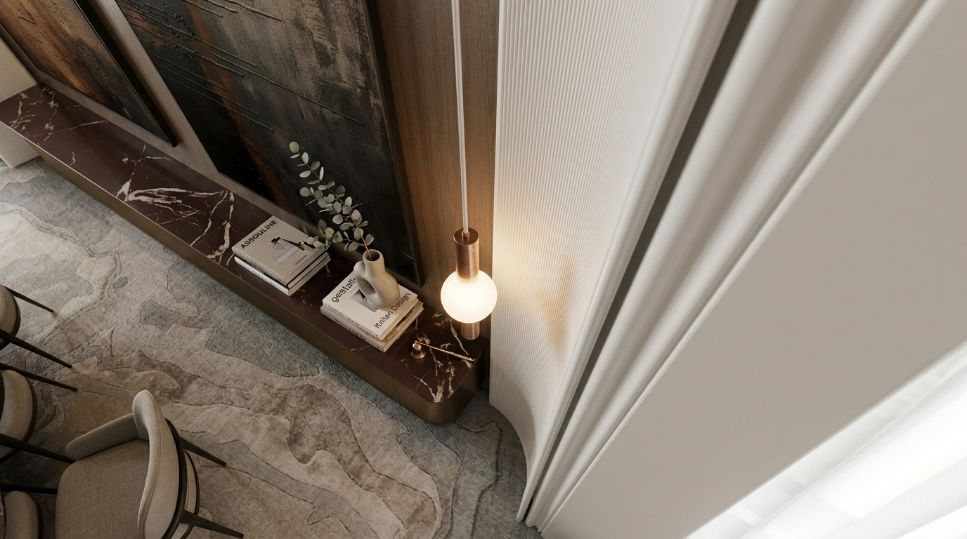 Premium villa extension finishes in Dubai with a marble console, bronze pendant light and ribbed white paneling