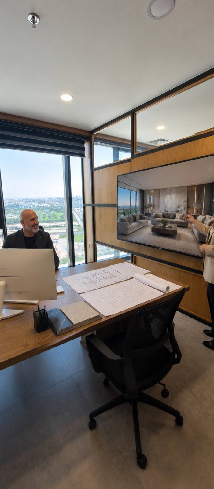 Chadi Baaklini reviewing villa drawings and finishes at the Dubai studio