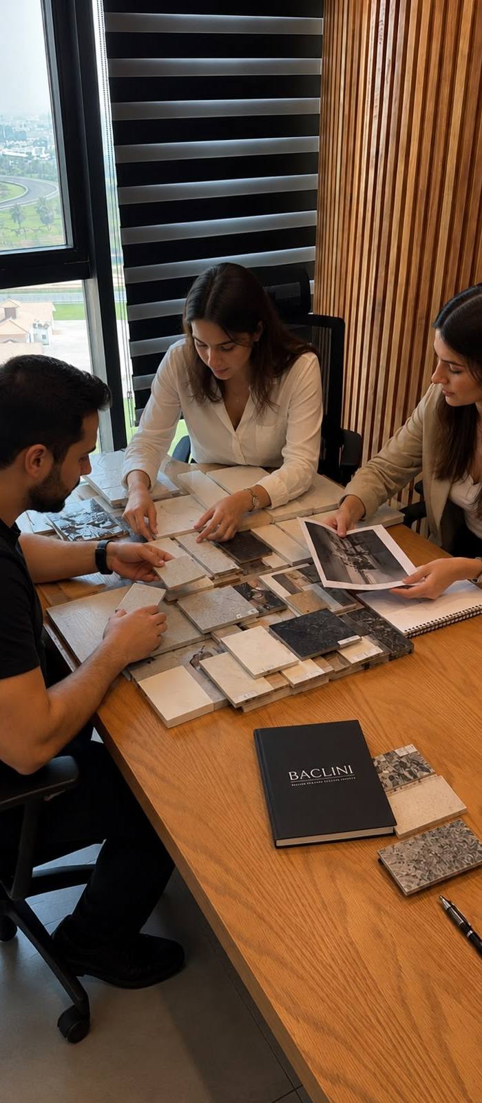 Design team reviewing stone and tile samples for a villa