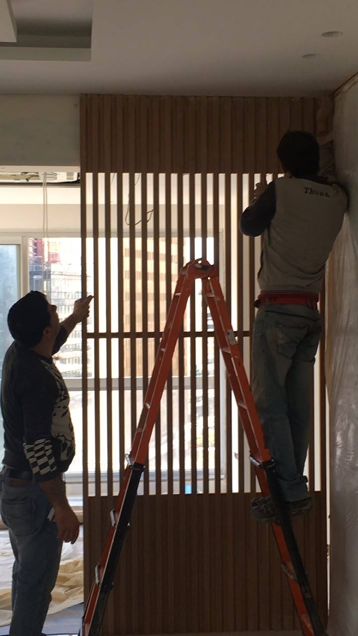 Slatted timber screen — during the build