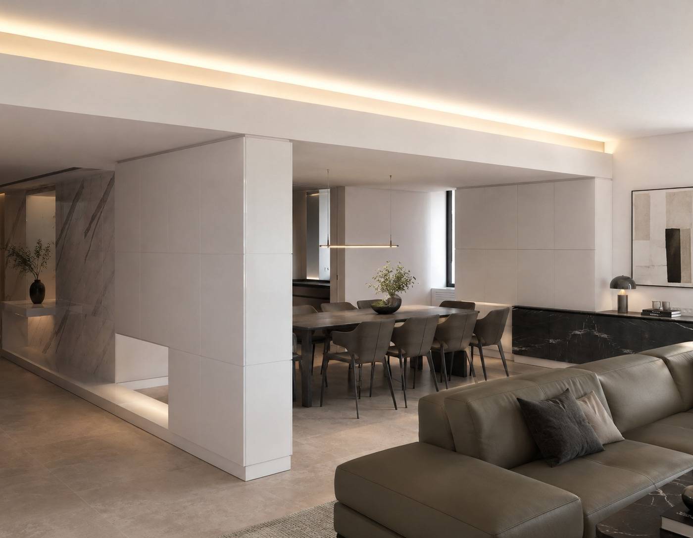 Open plan living and dining area with olive green leather sectional, dark marble dining table, and white paneled divider with integrated lighting by Chadi Baaklini in Dubai